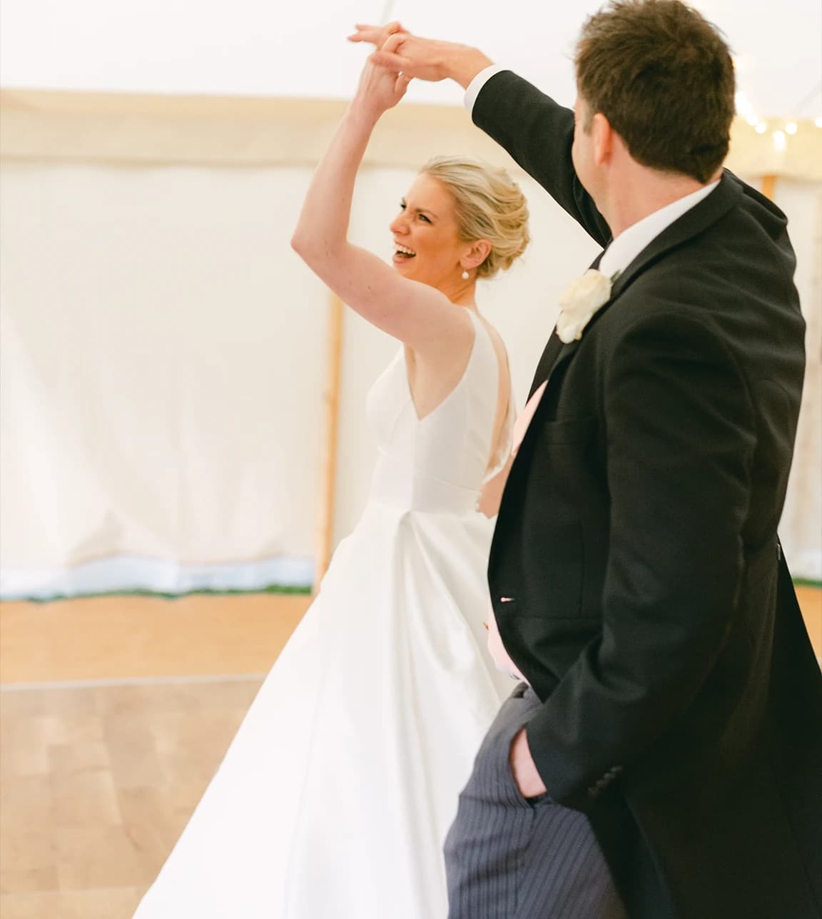 Traditional bride and groom do their first dance.