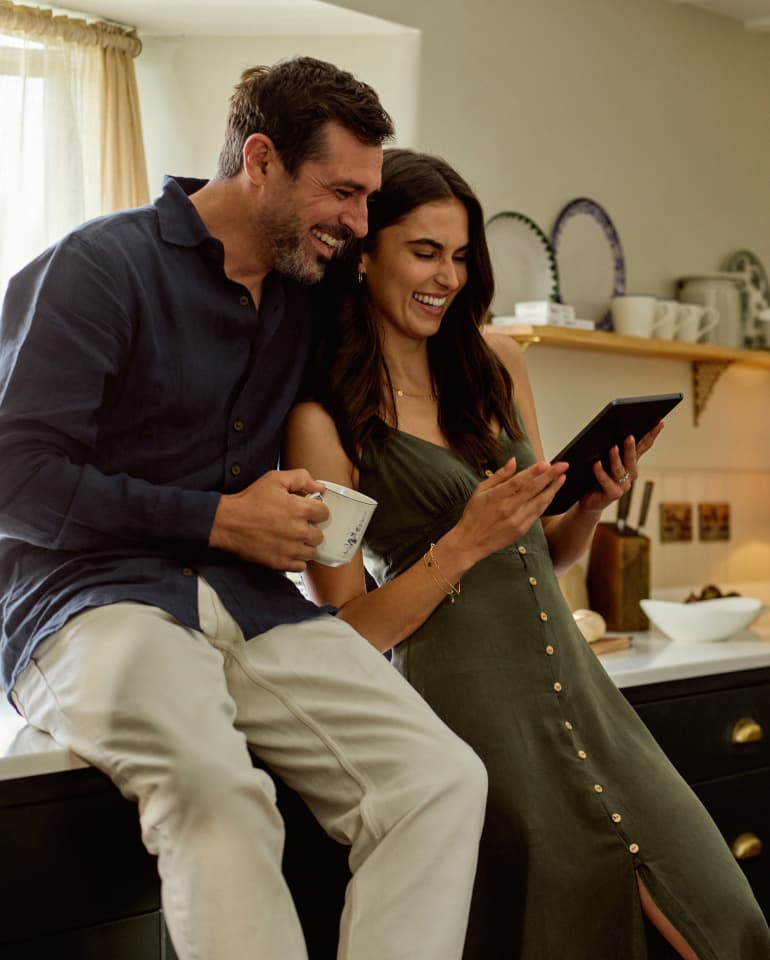 Couple using adding to their gift list