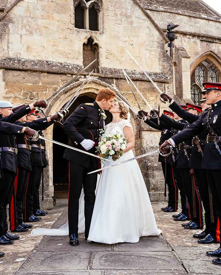 Couple kissing outside of church