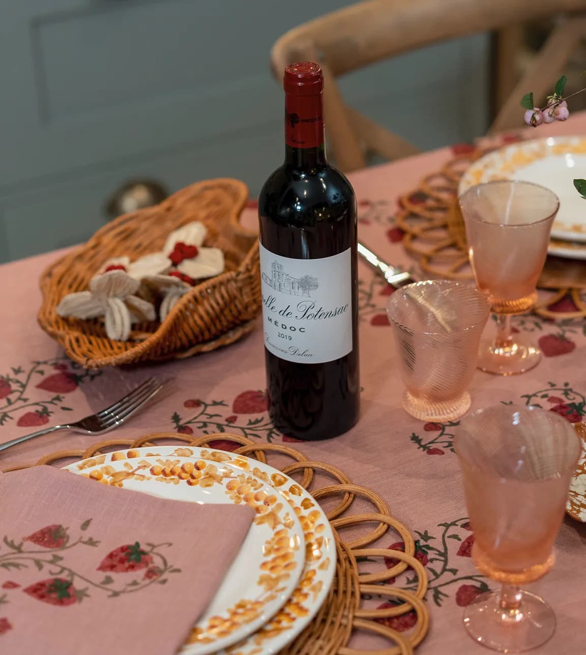 A bottle of wine on a beautifully set autumn-inspired tablescape in The Wedding Present Company showroom.