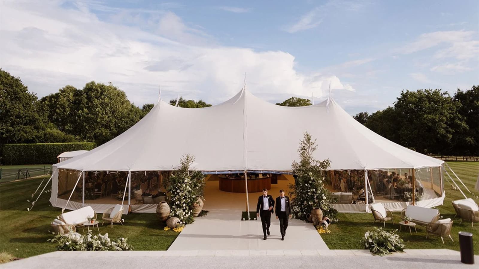 Same-sex couple leaves their sailcloth wedding marquee