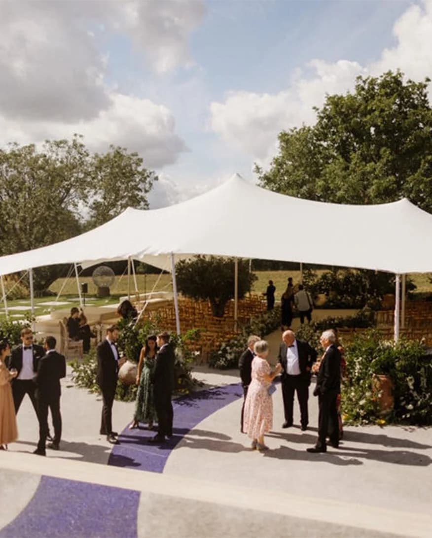 Wedding guests outside stretch tent marquee
