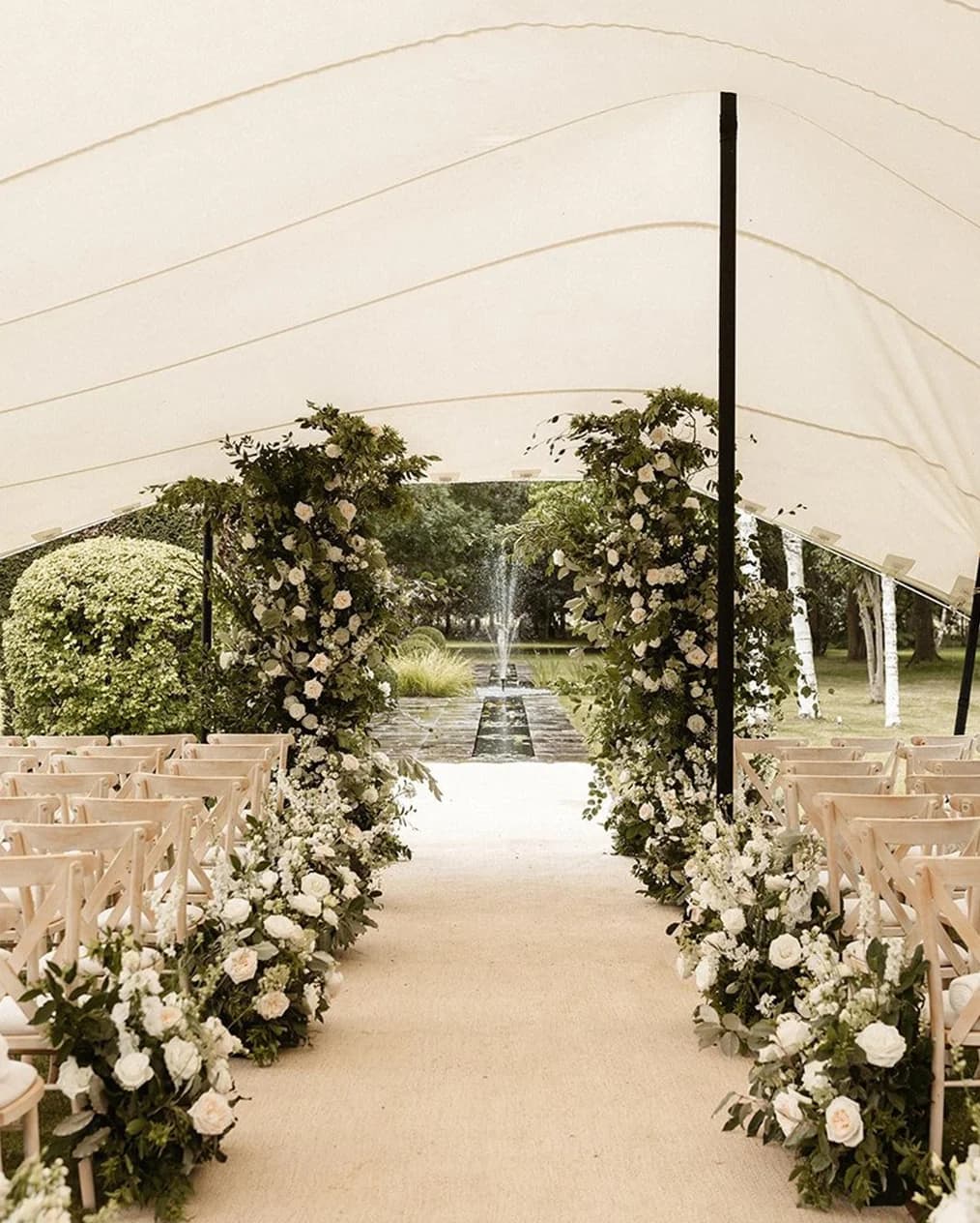 Wedding ceremony inside stretch tent marquee