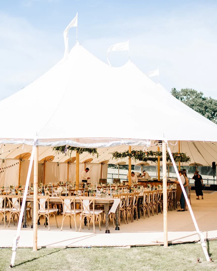 English wedding at traditional pole marquee with floral decoration