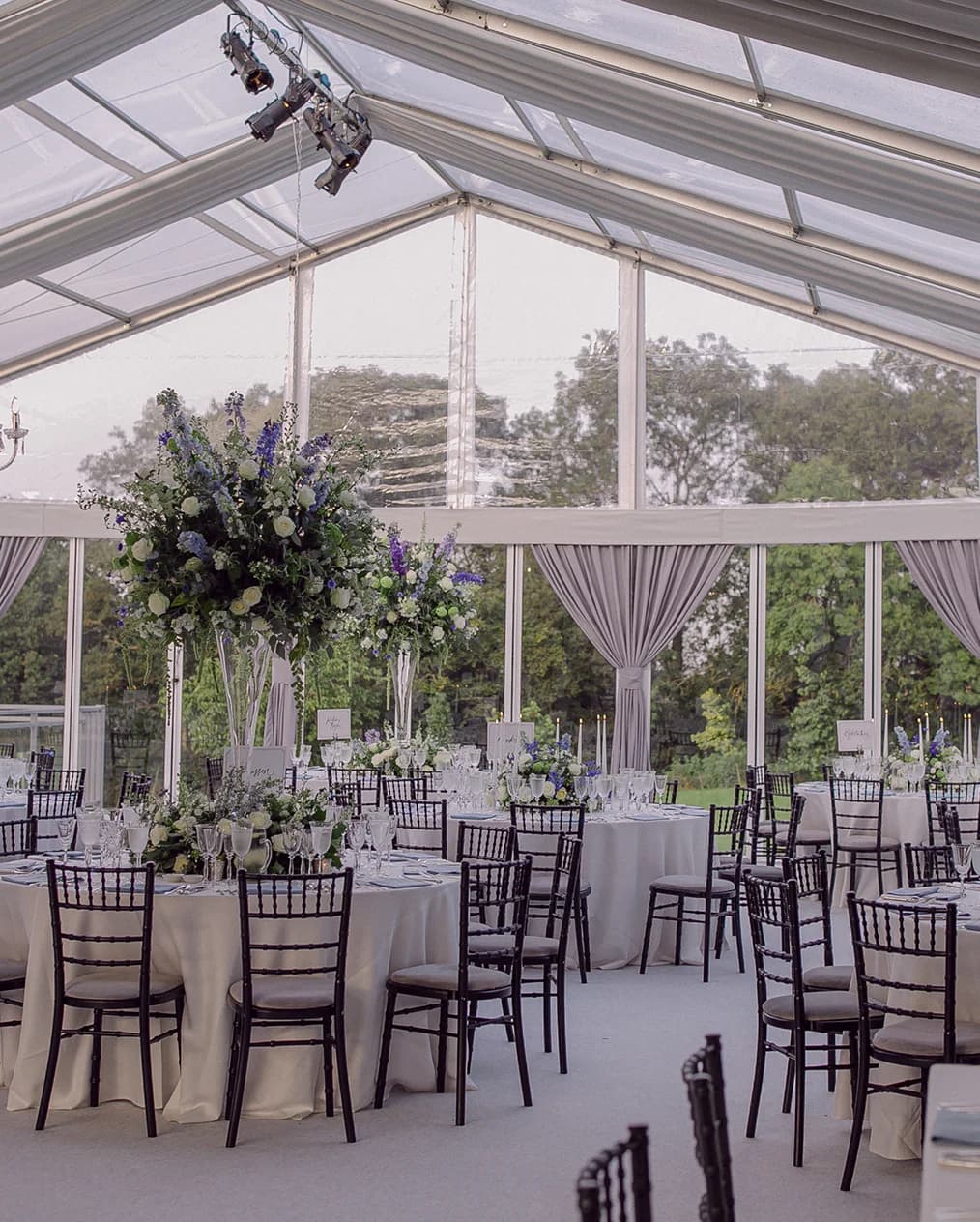 Luxe art-deco wedding decor inside clearspan framed marquee