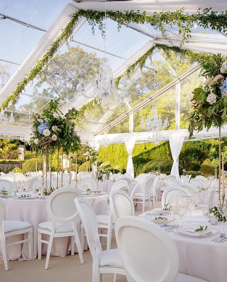 Luxury wedding decor and floral displays inside clearspan wedding marquee