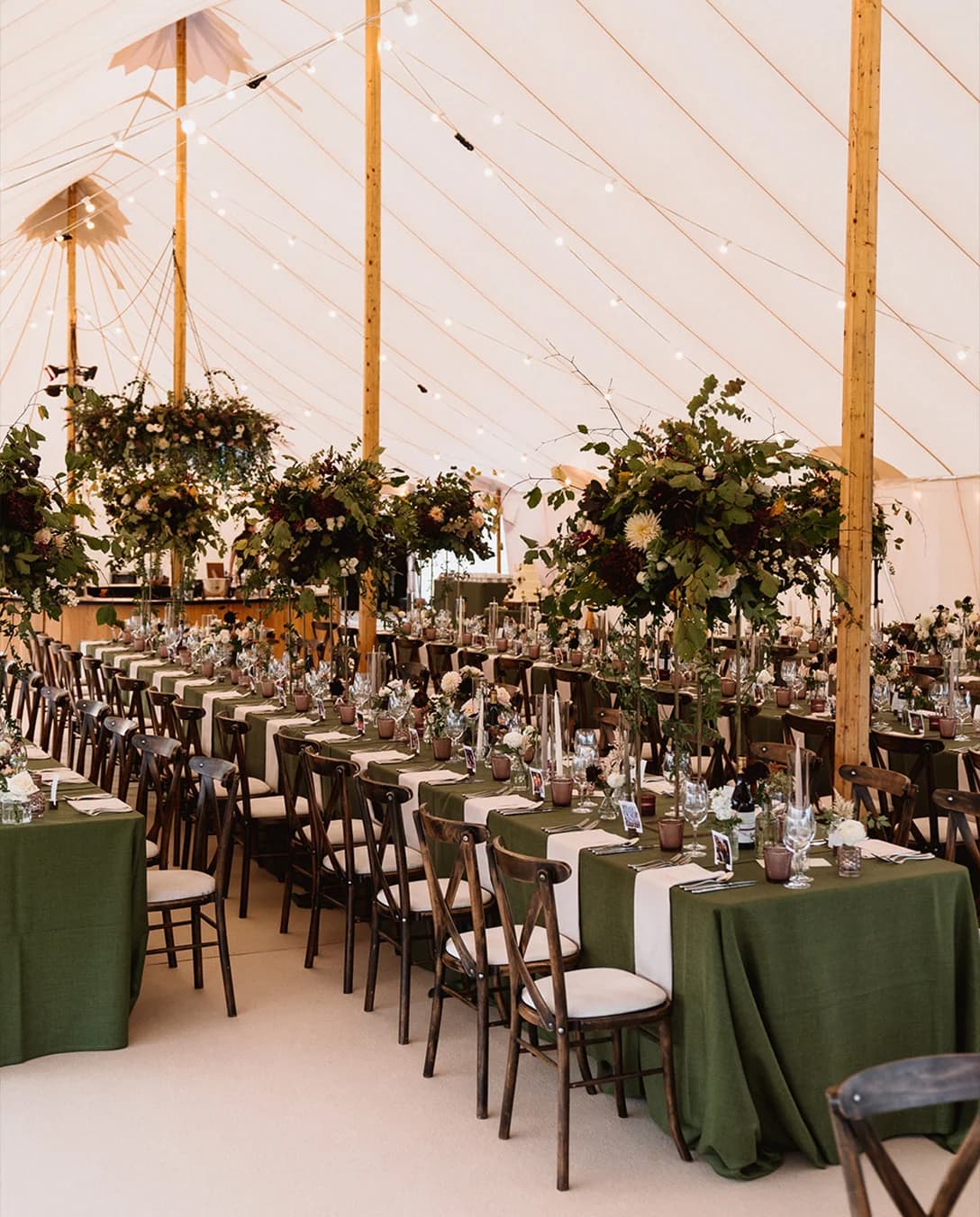 Wedding décor inside traditional pole marquee