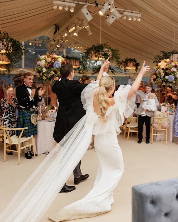 Bride and groom arrive to their wedding marquee