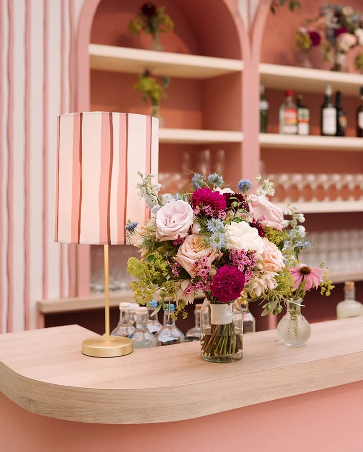 Floral wedding décor at the marquee wedding bar
