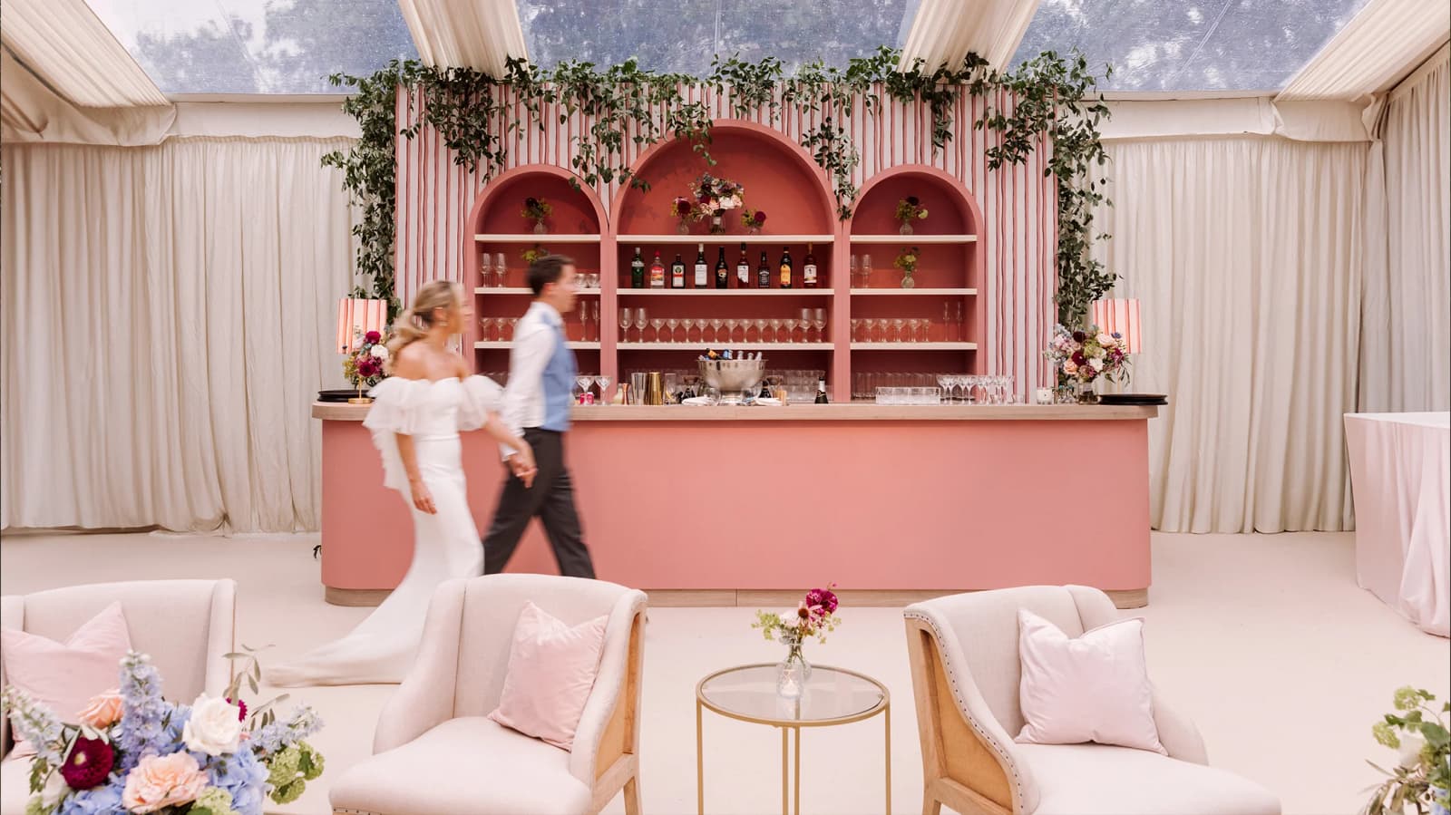 Stylish pink wedding bar area inside clearspand framed marquee
