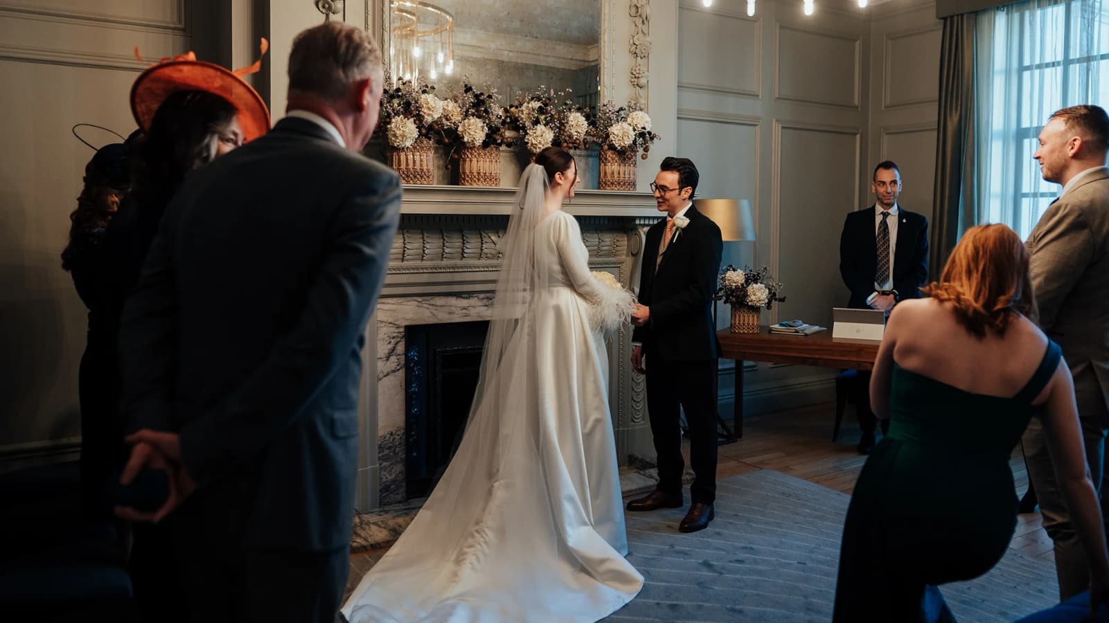 Bride and room getting married in the registry office room