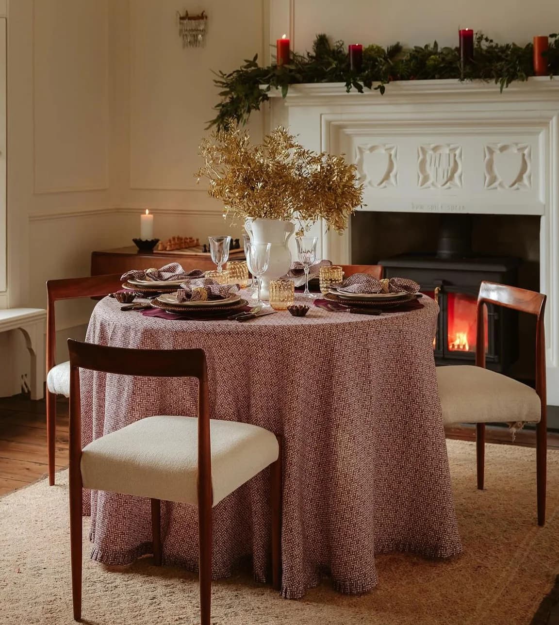 A beautifully set Christmas table with floral centerpiece