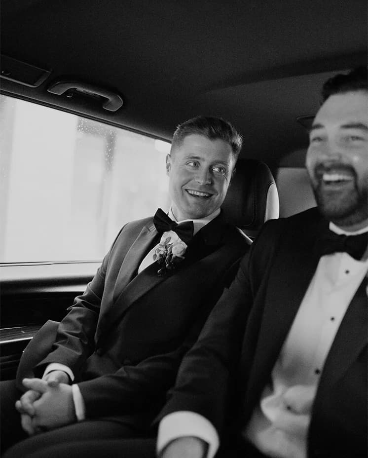 Groom sits in the cab, enroute to his wedding