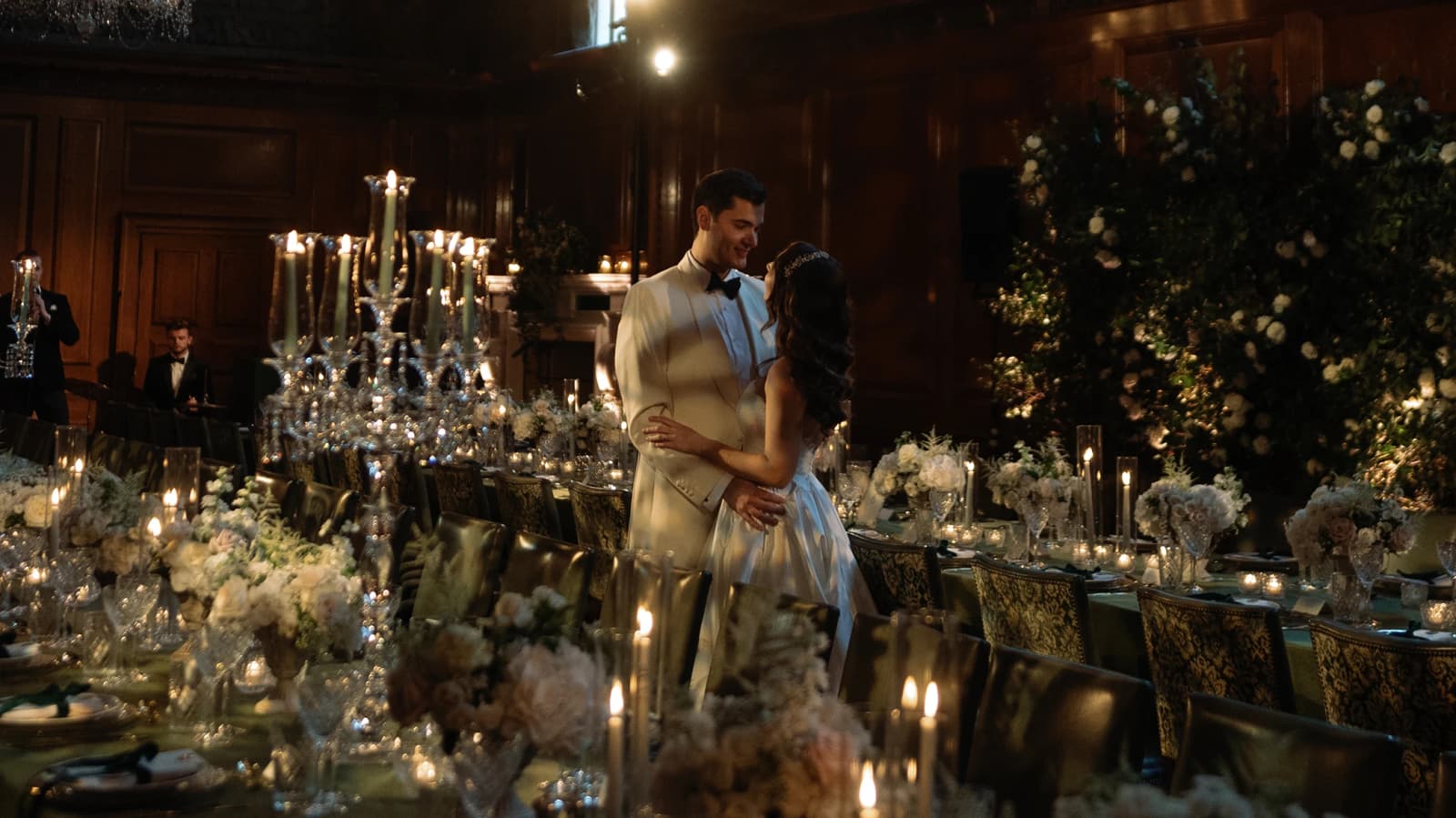 Romantic wedding reception at The Ned London with candlelit tables, floral décor, and couple dancing in an elegant setting