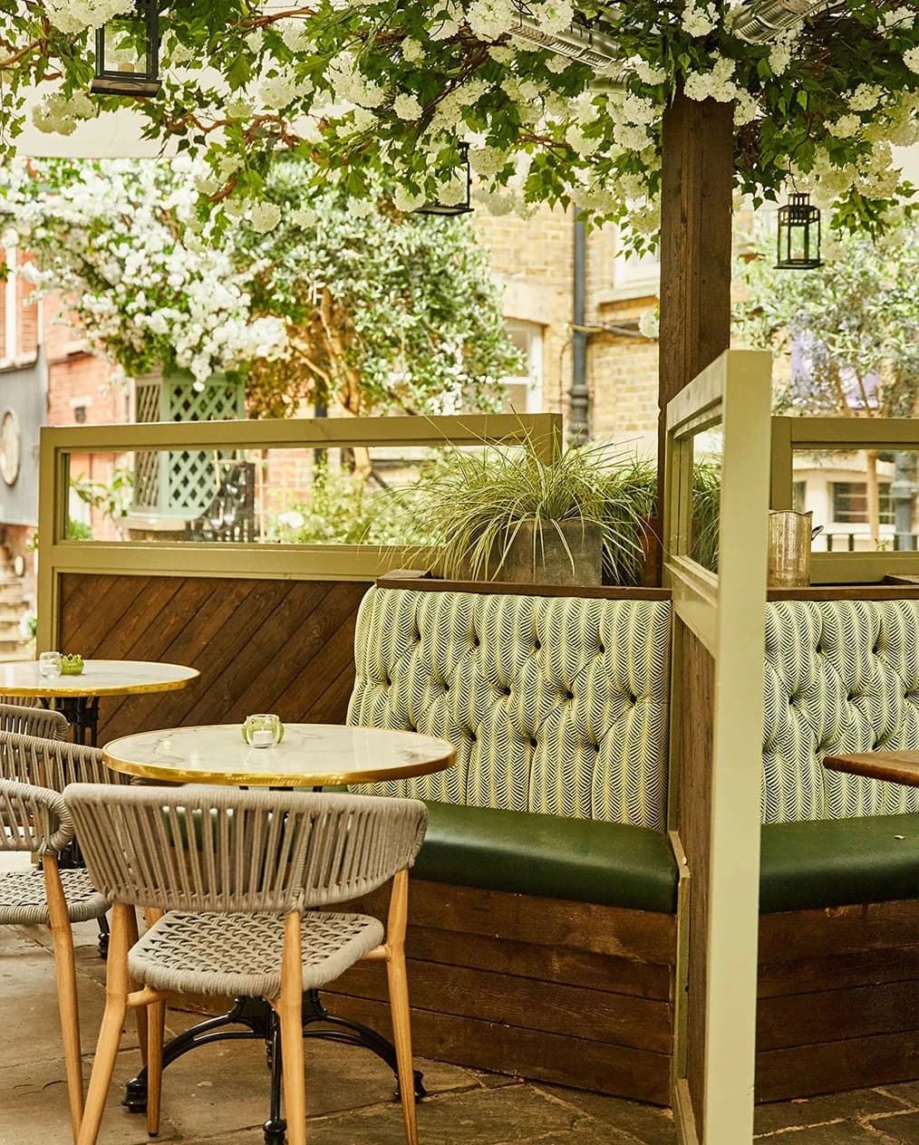 Outdoor seating area at Stanley’s Chelsea London wedding venue with garden terrace, greenery, and relaxed atmosphere