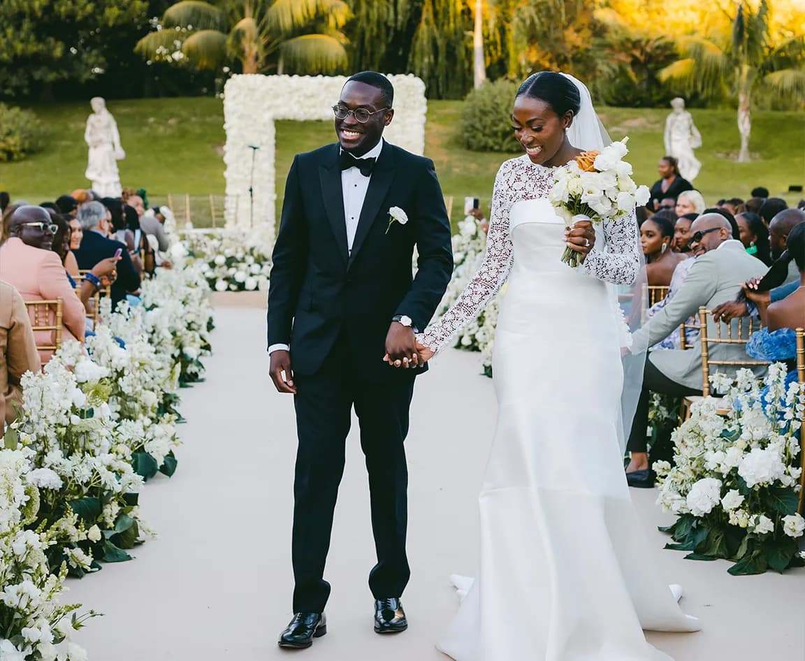 Bride and groom walk down the aisle after their wedding ceremony